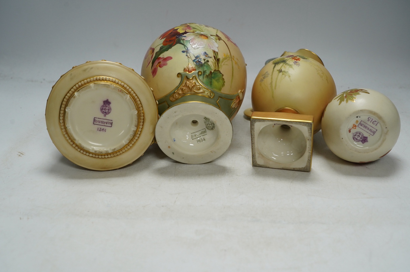 Four Worcester blush ivory floral vases and ewers, 1215, 1361, 1968 & 1654, largest 22cm high. Condition - good